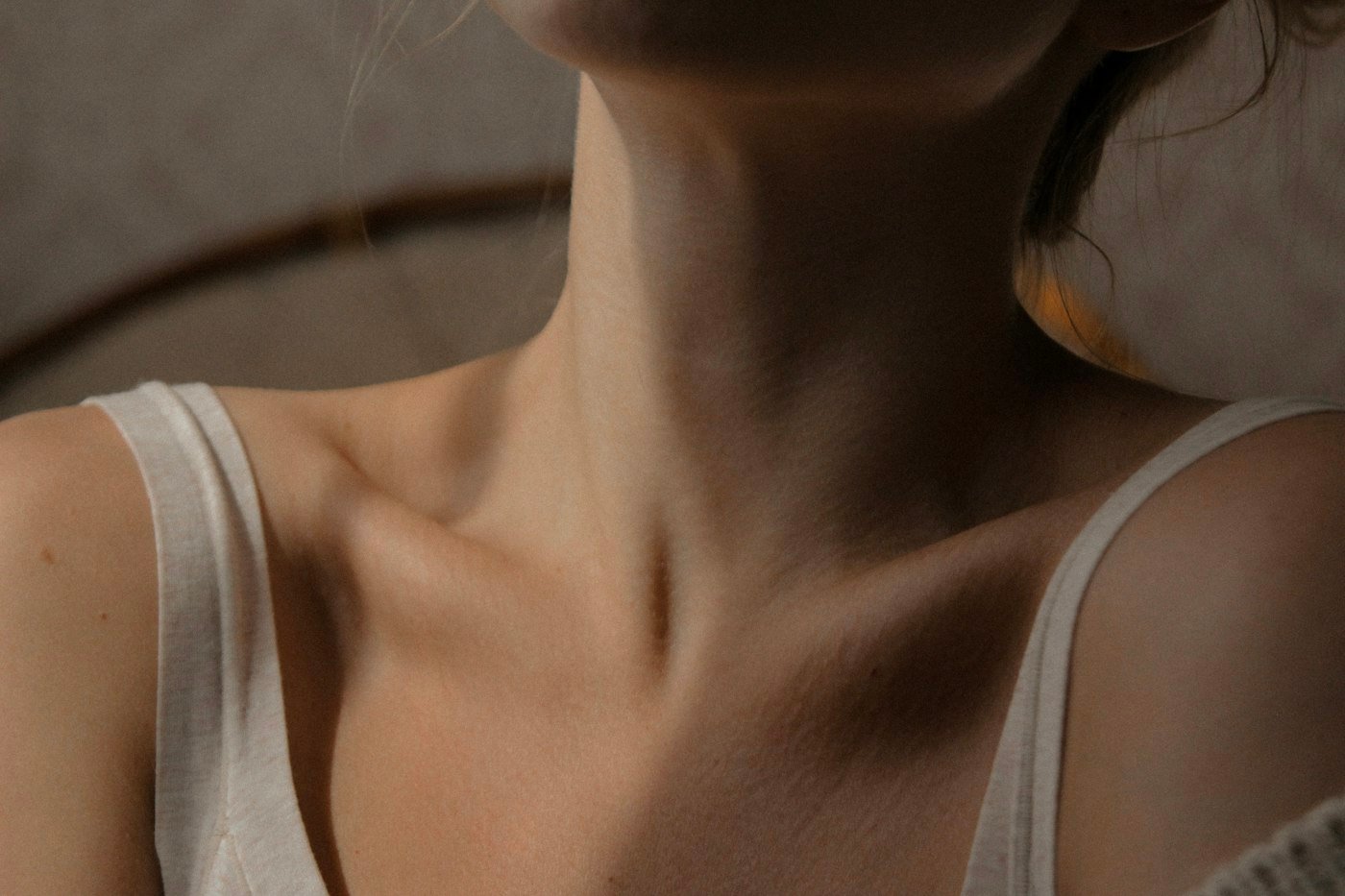 Close-up of a woman's smooth neck and collarbone